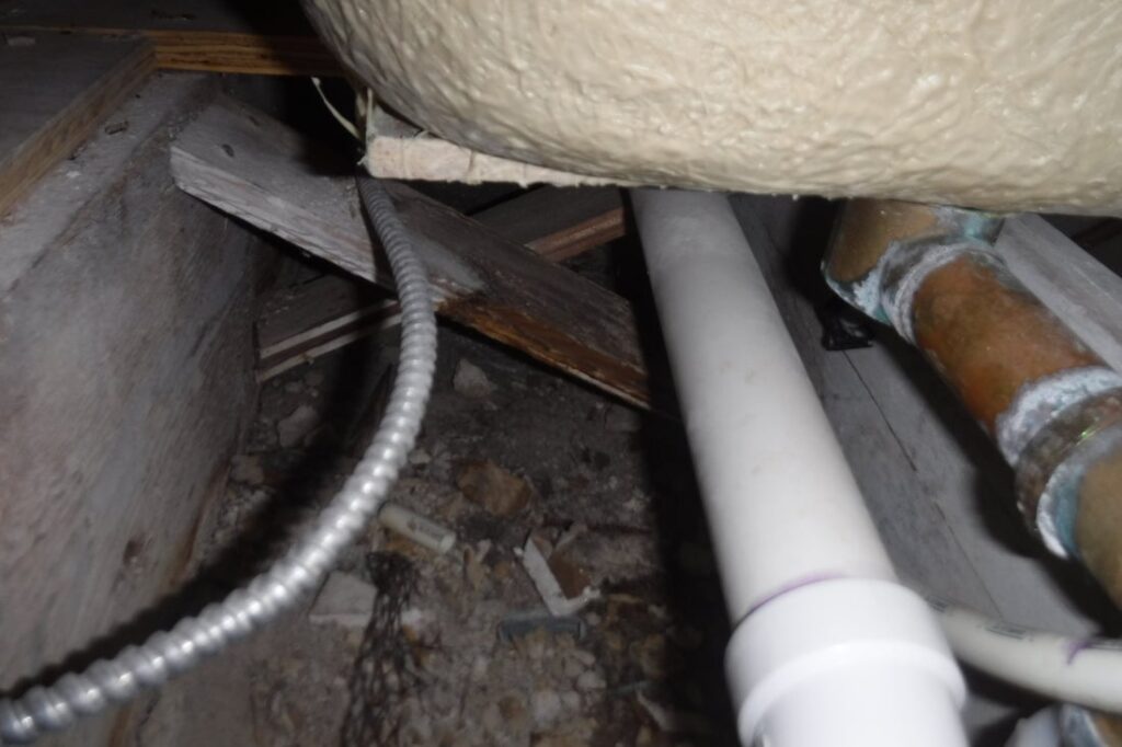 Inspector finds corroded plumbing and electrical issues during pre-purchase inspection.