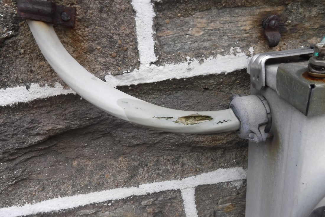 Damaged exterior conduit identified during home inspection services